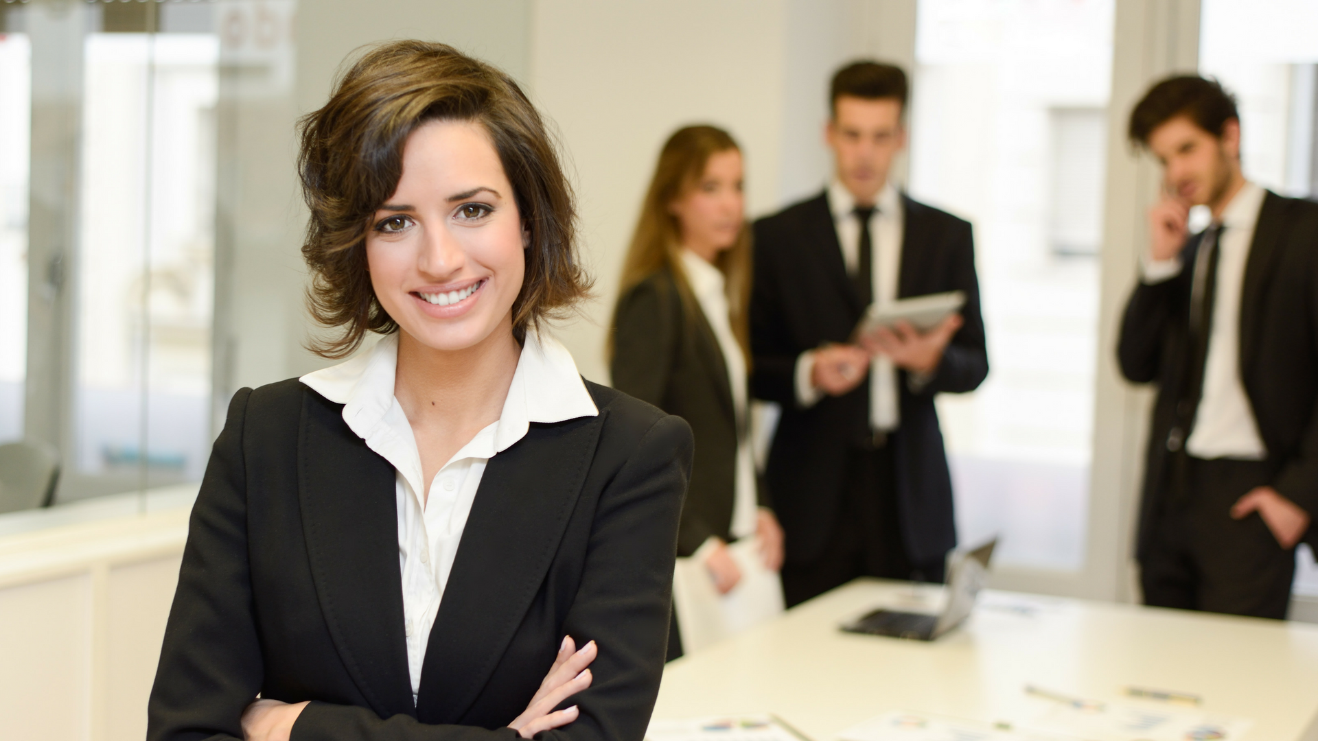 smiling executive with crossed arms