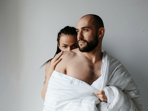 Wife Hiding Behind Husband